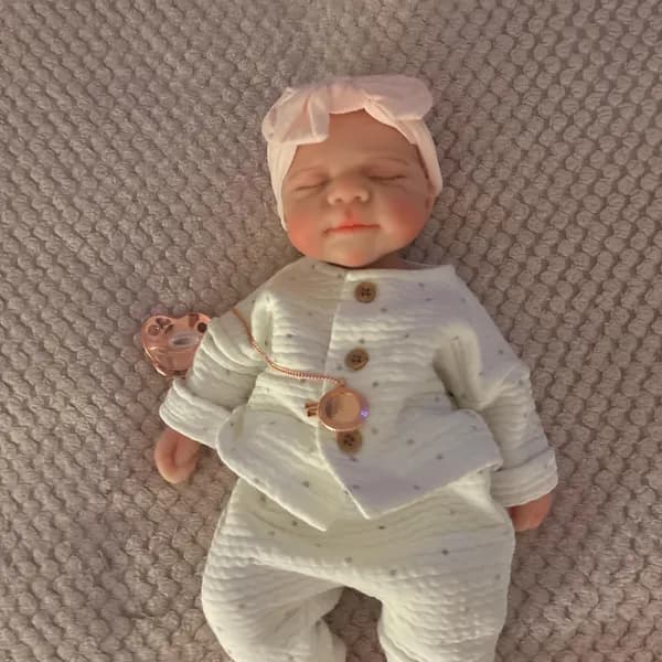 Photo of their Dollnest baby shared by Aby