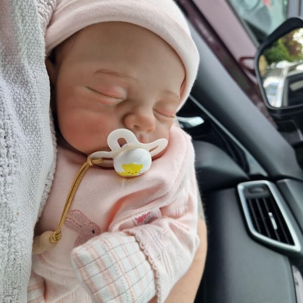 Photo of their Dollnest baby shared by Katie