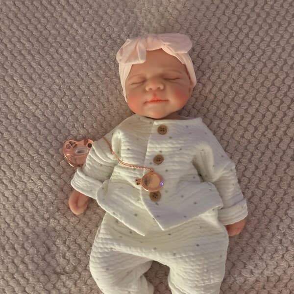 Photo of their Dollnest baby shared by Aby