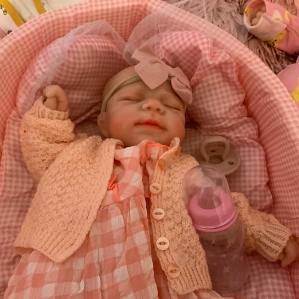 Photo of their Dollnest baby shared by Jayne
